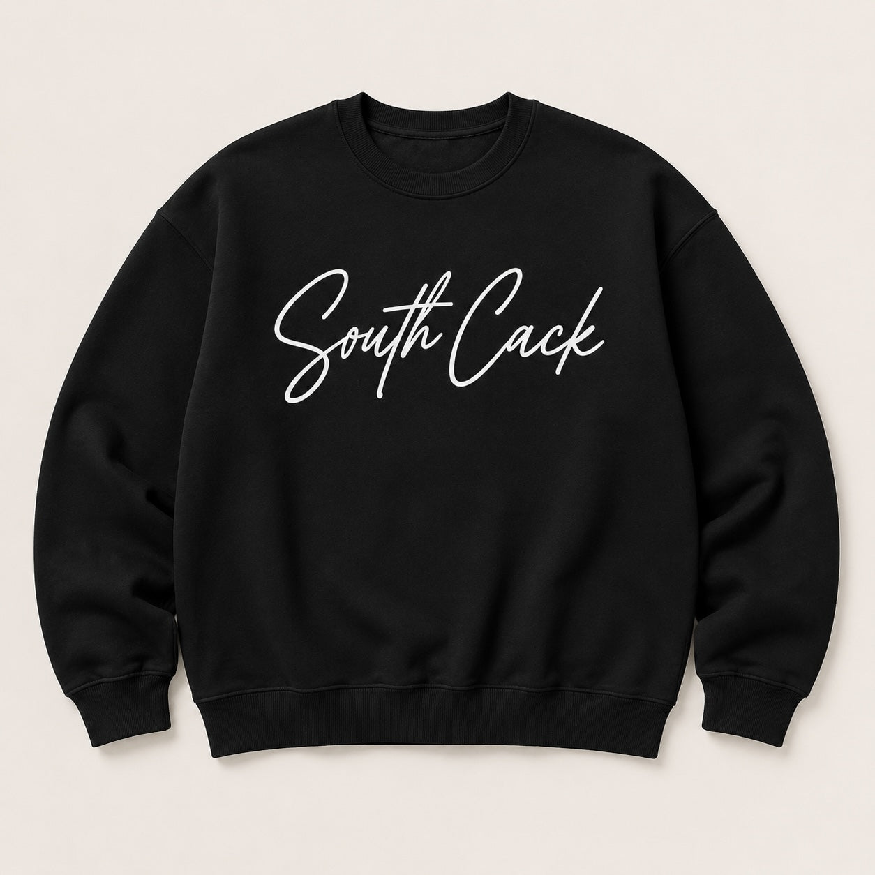 saysomethingteez black crewneck sweatshirt with white South Cack script graphic, featuring ribbed cuffs and hem.