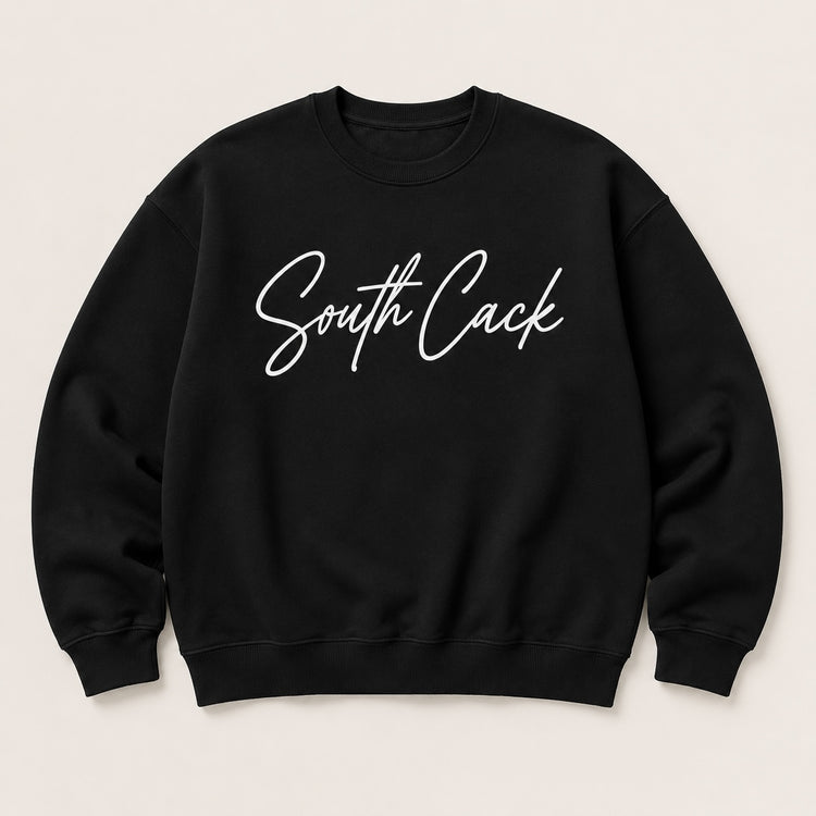 saysomethingteez black crewneck sweatshirt with white South Cack script graphic, featuring ribbed cuffs and hem.