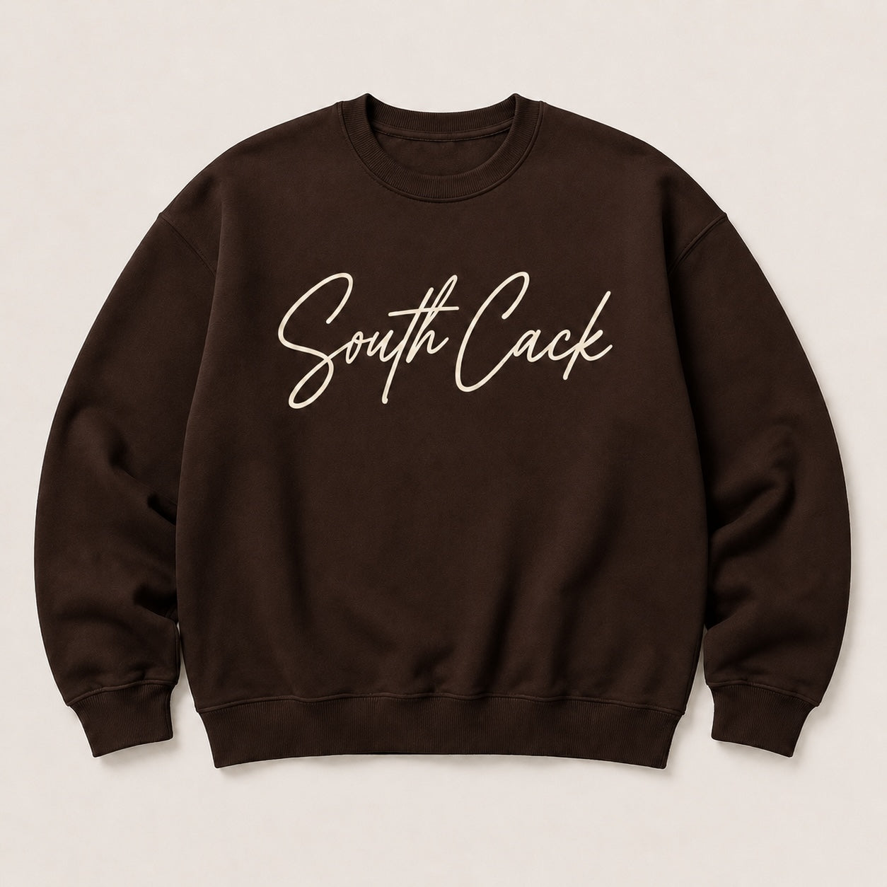 saysomethingteez dark brown crewneck sweatshirt with South Cack script graphic in cream on the chest
