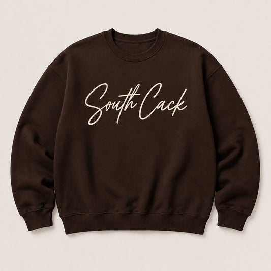 saysomethingteez dark brown crewneck sweatshirt with South Cack script graphic in cream on the chest